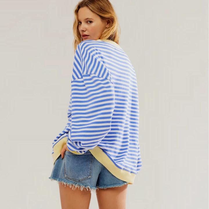 Damen Oversized Strickpullover aus weichem Material mit buntem Streifenmuster und lässigem Schnitt für Komfort und Stil.