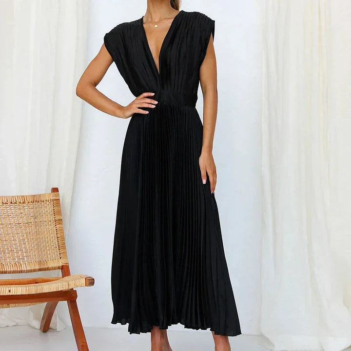 Damen Plissee Midi-Kleid mit V-Ausschnitt aus leichtem Stoff in elegantem Design für besondere Anlässe.