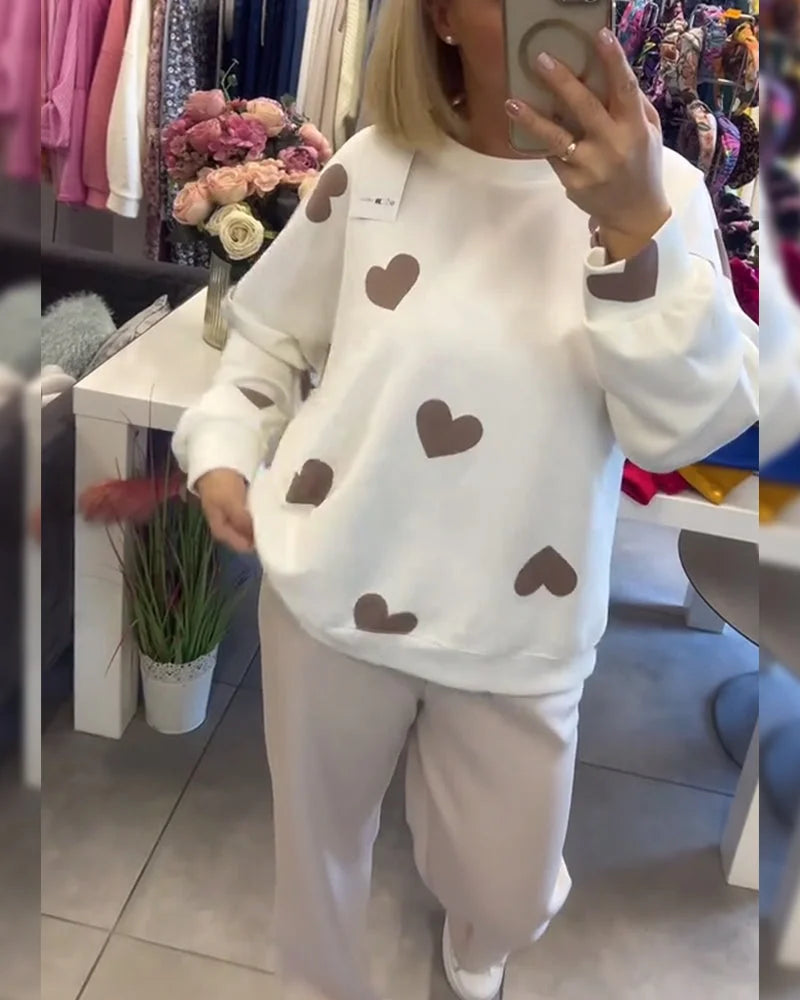 Damen Pullover in Weiß aus Baumwollmix mit Herzmuster für einen lässigen, gemütlichen Look.