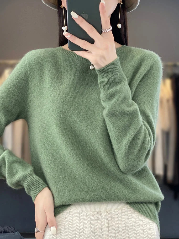 Türkisfarbener Damenpullover mit langen Ärmeln, aus weicher Baumwollmischung, ideal für kalte Tage.