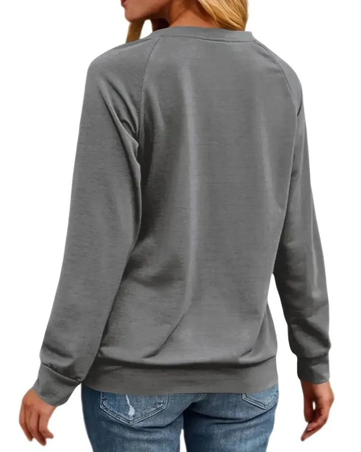 Damen Pullover aus weichem Baumwollmix mit buntem Weihnachtsmotiv und Rundhalsausschnitt, ideal für die Festtage.