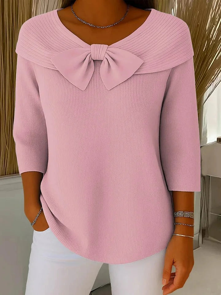 Rosa Damen Pullover mit Schleife und Rundhalsausschnitt, gefertigt aus weichem Baumwoll-Mix für angenehmen Tragekomfort.