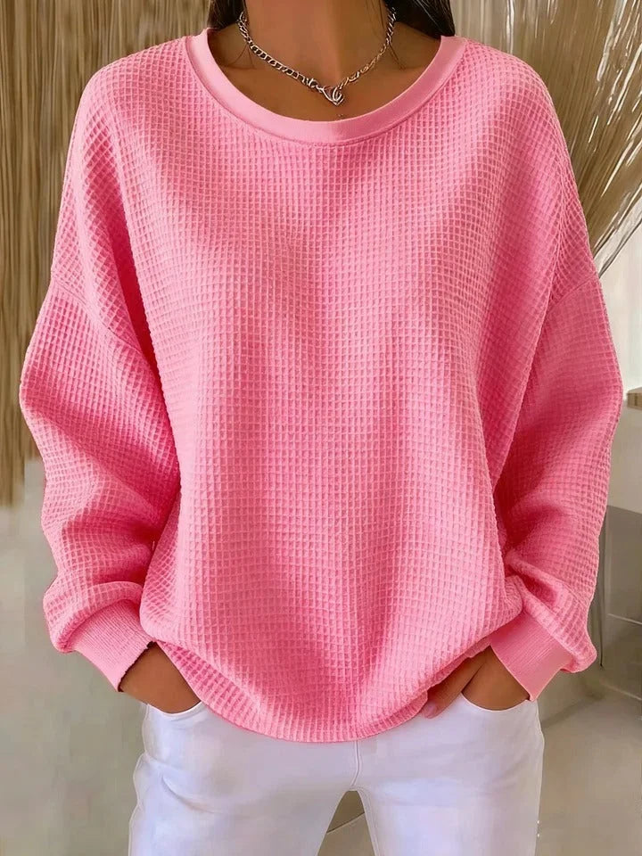 Rosa Damen Pullover mit strukturiertem Design, Rundhalsausschnitt und weichem Material für angenehmen Tragekomfort.