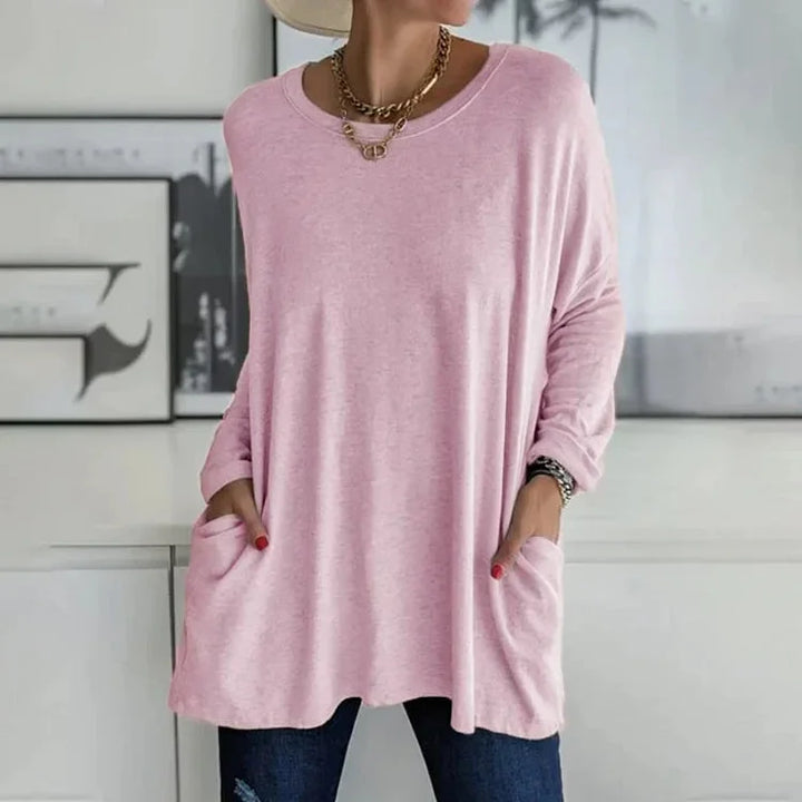 Rosa Damen Pullover mit Taschen und Rundhalsausschnitt, aus weichem Baumwollmaterial, lässiger Schnitt für Komfort und Stil.