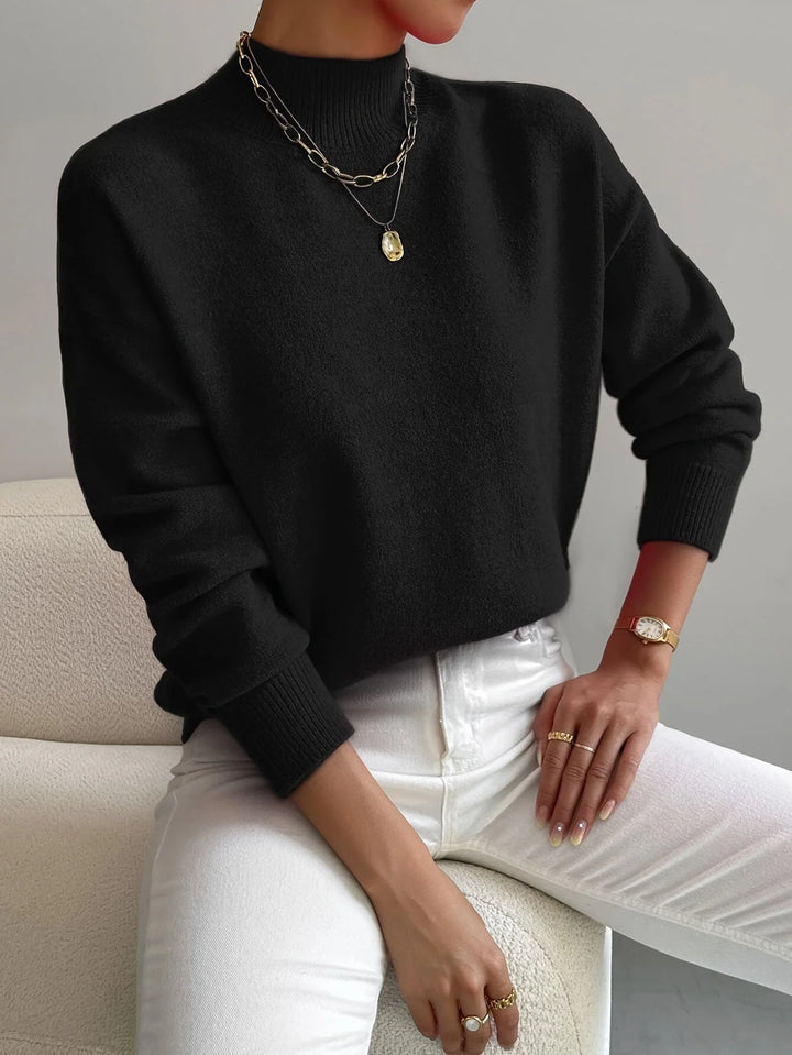 Schwarzer Damen Rollkragenpullover aus weicher Wolle mit gemütlichem Schnitt und langen Ärmeln für warmen Tragekomfort.