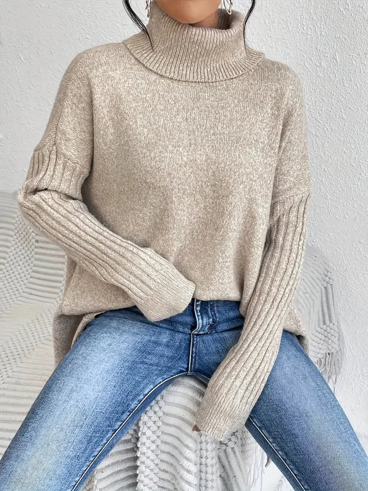Damen Rollkragenpullover aus weicher Baumwolle, mit langen Ärmeln und lockerer Passform in sanften Farbtönen.