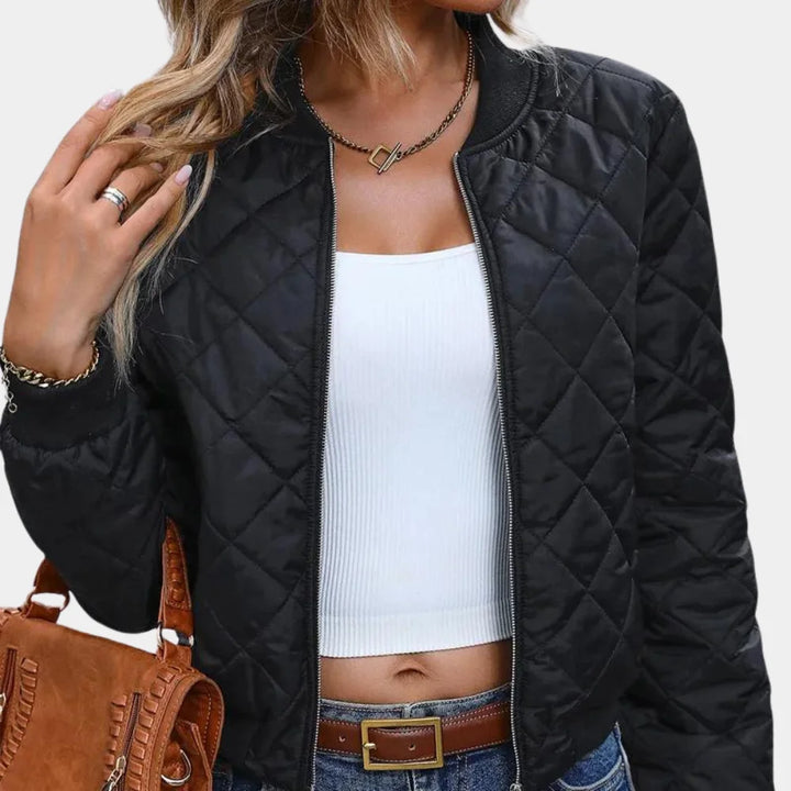 Damen schwarze Stepp-Bomberjacke aus strapazierfähigem Material mit Reißverschluss und elastischen Bündchen für optimalen…