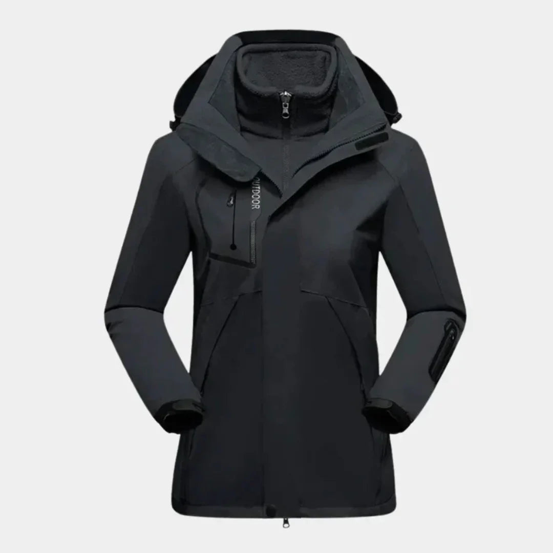 Schwarze Damen Skijacke mit Fleece-Innenfutter, abnehmbarer Kapuze und funktionalen Taschen für Komfort beim Skifahren.