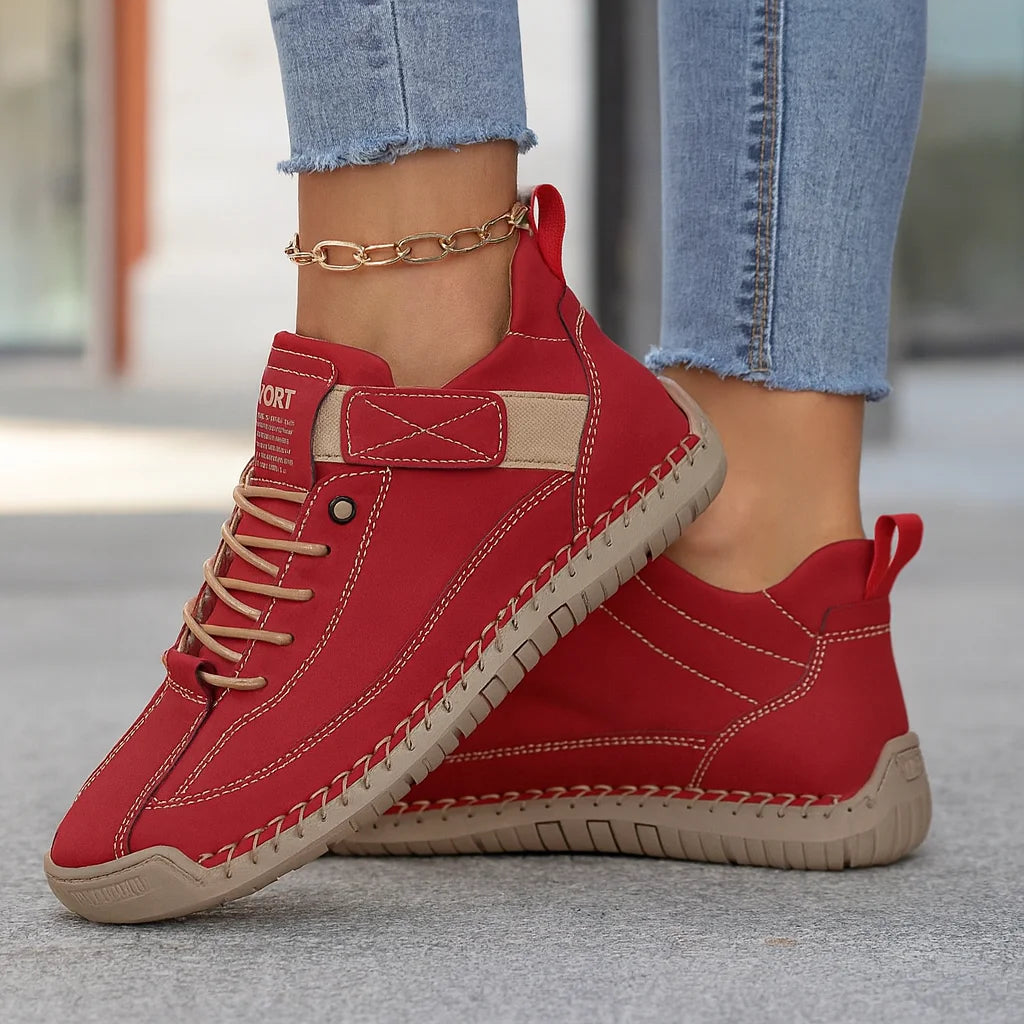 Rote Damen Sneaker mit elastischer Sohle und klettbarem Verschluss, aus atmungsaktivem Material für hohen Komfort.