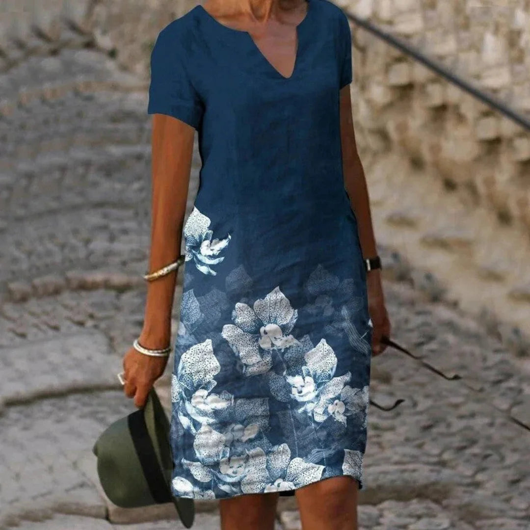 Damen Sommerkleid in Blau mit Blumendruck, V-Ausschnitt, leichten Stoff. Ideal für den Sommer, elegant und luftig.