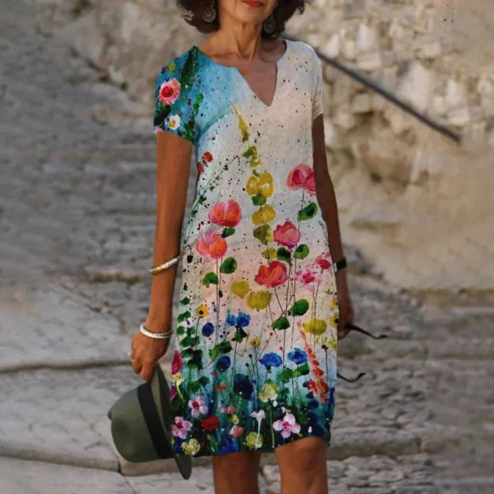 Multicolor Sommerkleid für Damen mit Blumendruck, V-Ausschnitt, leichtem Stoff, ideal für den Sommer und Freizeitaktivitäten.