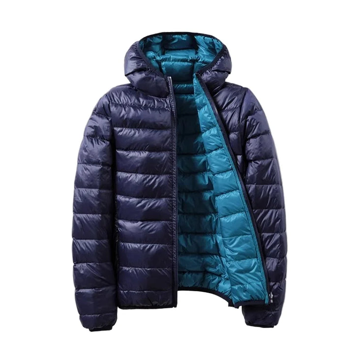 Damen Steppjacke in Blau, mit Kapuze, leichtem Futter und gestepptem Design für Wärme und Komfort. Ideal für den Alltag.
