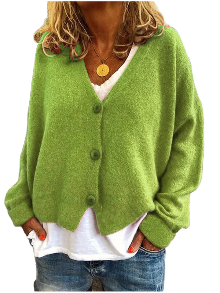 Damenkurzstrickjacke in Hellgrün, V-Ausschnitt, mit Knöpfen, aus weichem Material für angenehmen Tragekomfort.