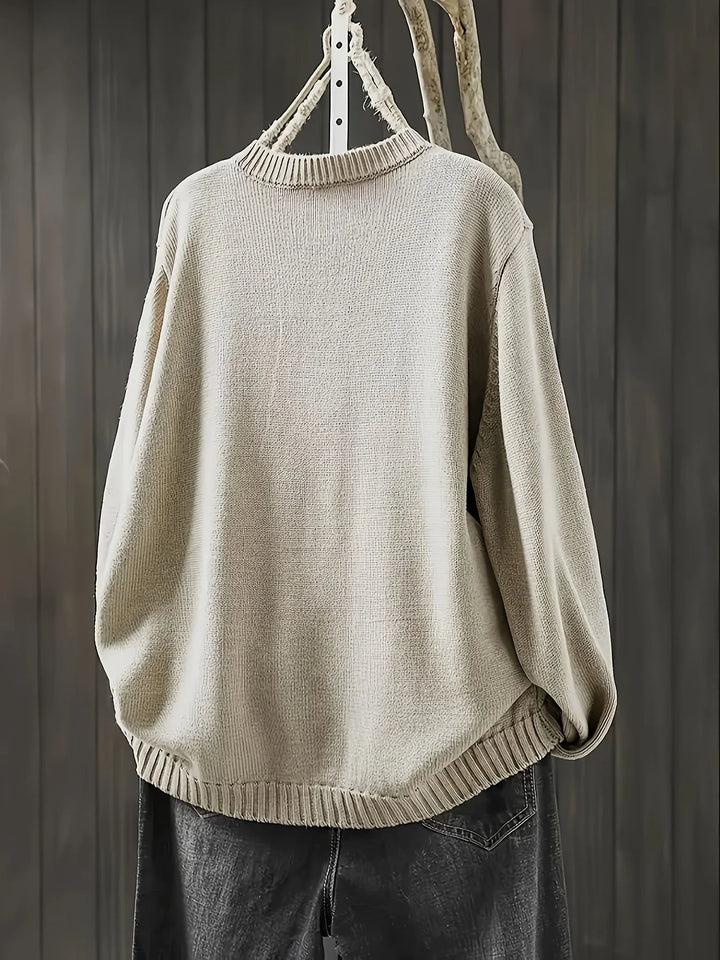 Damen Strickjacke aus weichem Material mit bunten Knöpfen und lässigem Design, ideal für herbstliche Outfits.