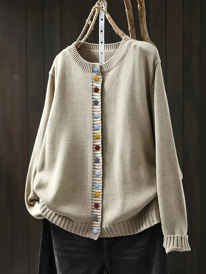 Beige Damen Strickjacke mit bunten Knöpfen, gemütlicher Schnitt aus weichem Material, ideal für lässige Outfits.