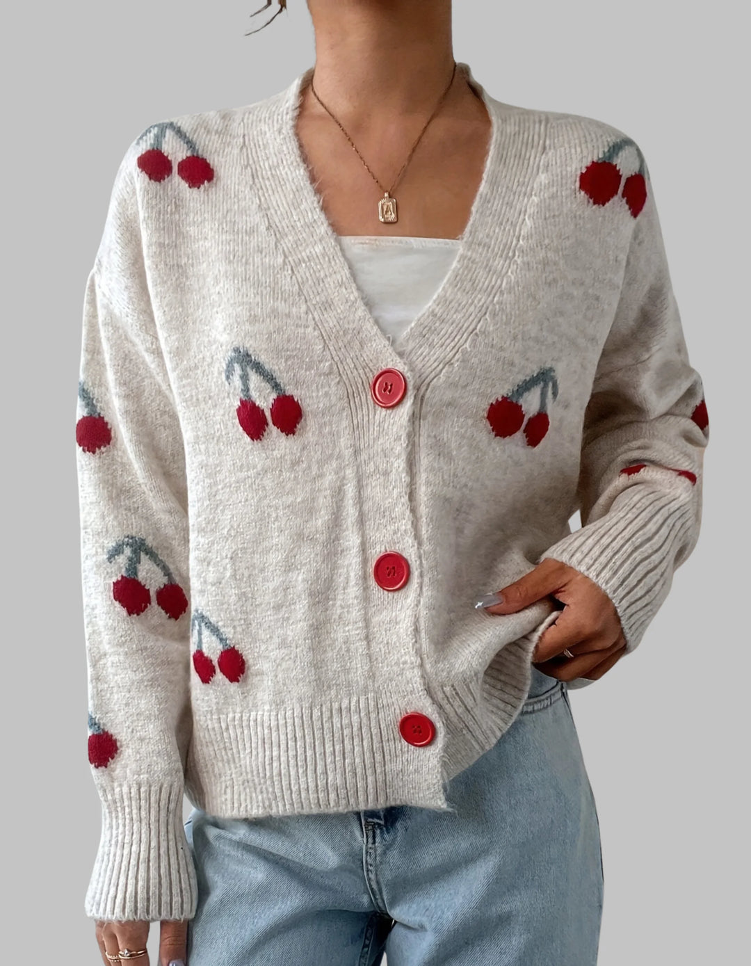 Damen Strickjacke in Aprikose mit Knopfleiste, langen Ärmeln und weichem, angenehmem Material für komfortable Passform.
