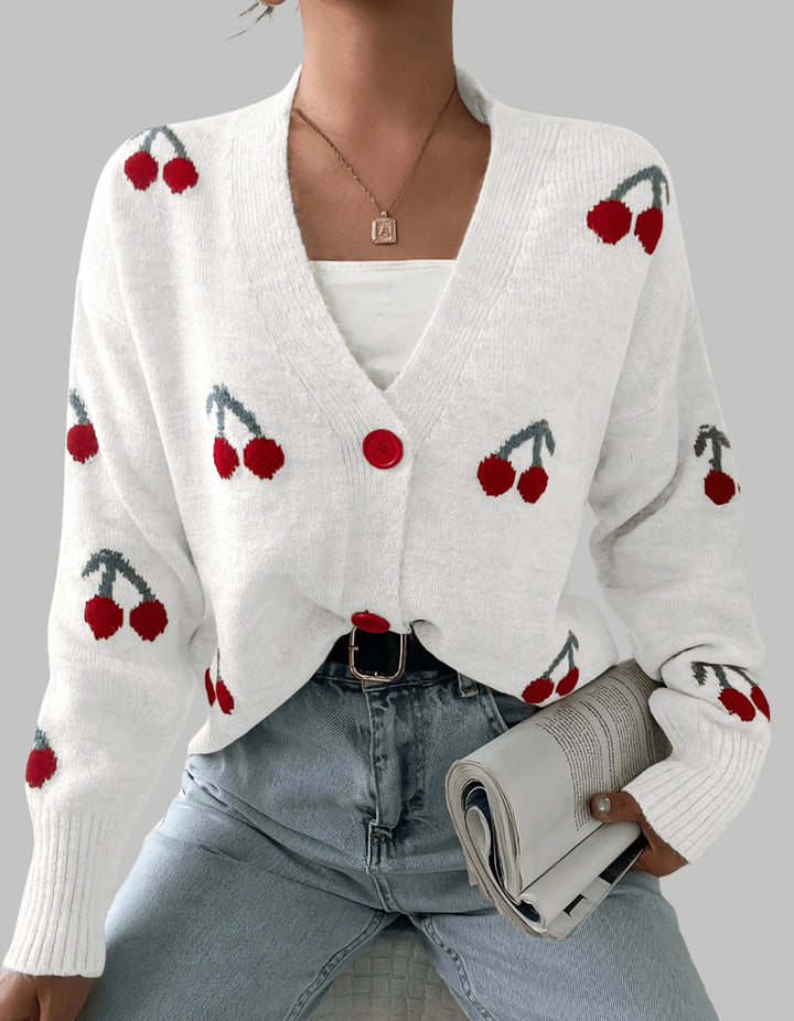Damen Strickjacke in Weiß mit Knopfleiste, langen Ärmeln und weichem Material für bequemen Tragekomfort.