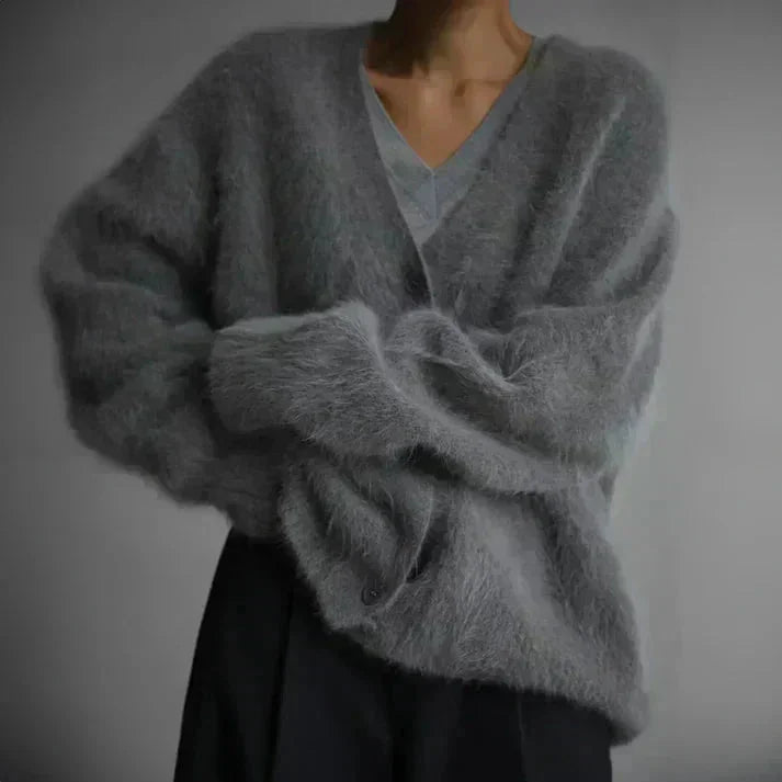 Damen Strickjacke aus weichem Material, mit Knöpfen und modernem Schnitt für gemütlichen Tragekomfort.