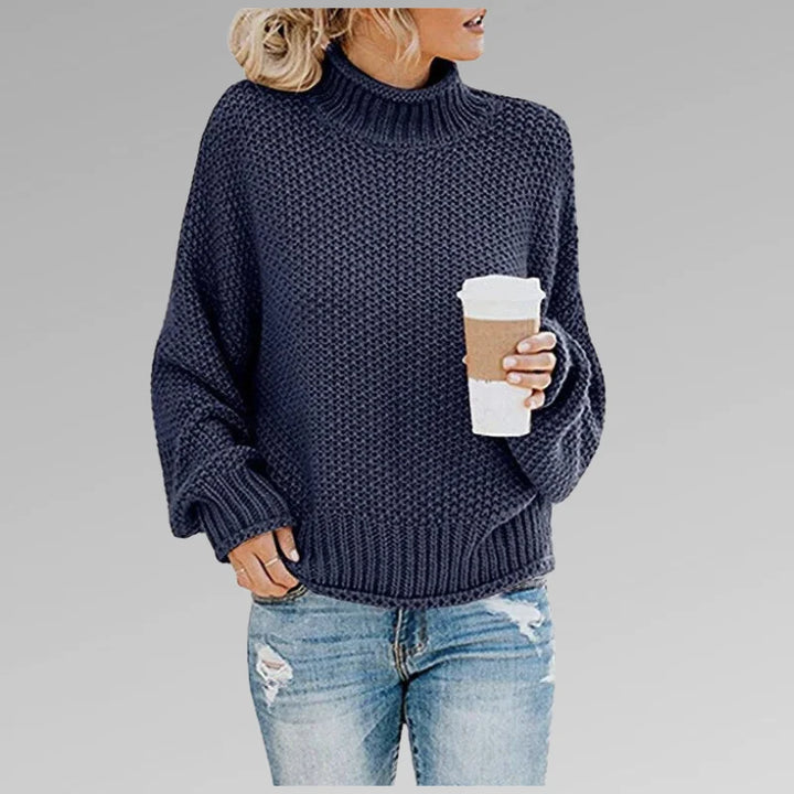 Blauer Damen Strickpullover mit Rollkragen, langen Ärmeln und gemütlicher, weicher Textur für angenehmen Tragekomfort.