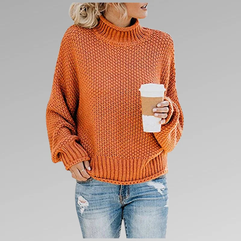 Orange Damen Strickpullover mit Rollkragen, langen Ärmeln und leichter Struktur aus weicher, warmer Wollmischung.