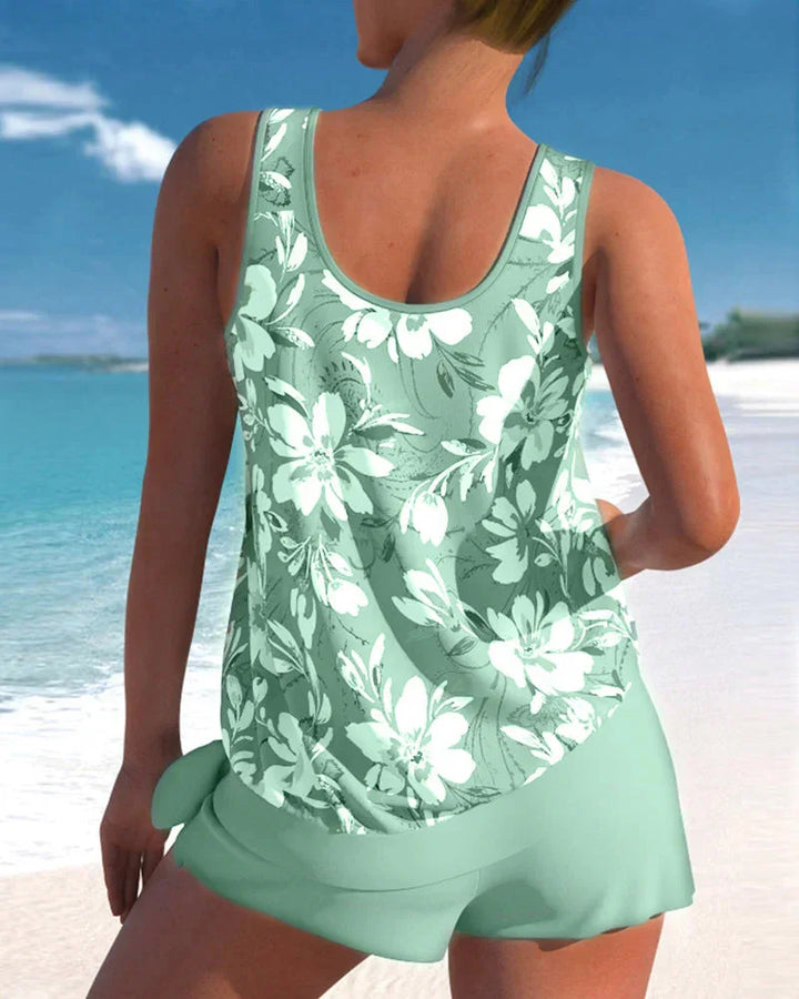 Damen Tankini Set aus elastischem Material mit auffälligem Blumenmuster und passender Shorts für den perfekten Sommer-Look.