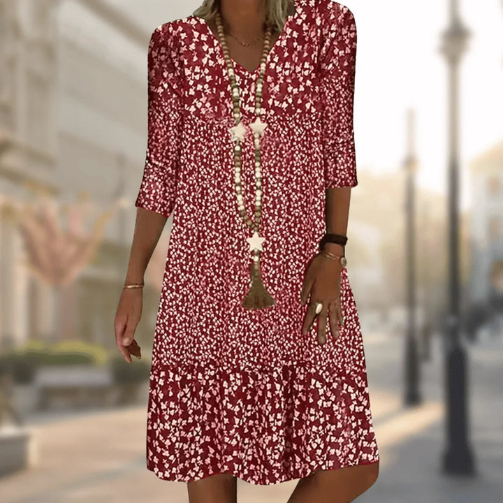 Rotes Damen Tunika-Kleid aus leichtem Stoff mit V-Ausschnitt und floralem Muster, ideal für den Sommer.