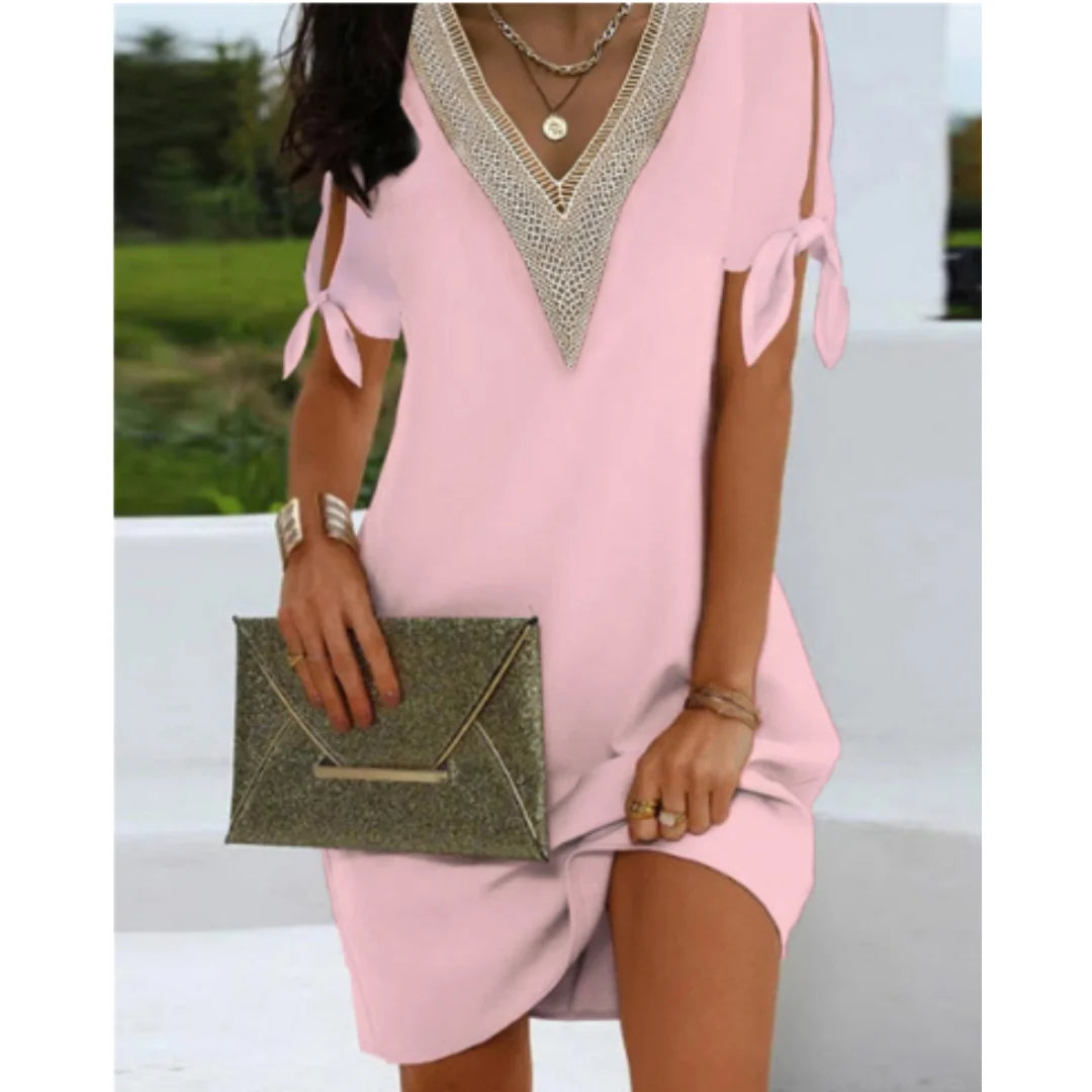 Rosa Damen Tunikakleid mit V-Ausschnitt und Schnürdetails, aus leichtem Stoff, ideal für den Sommer.