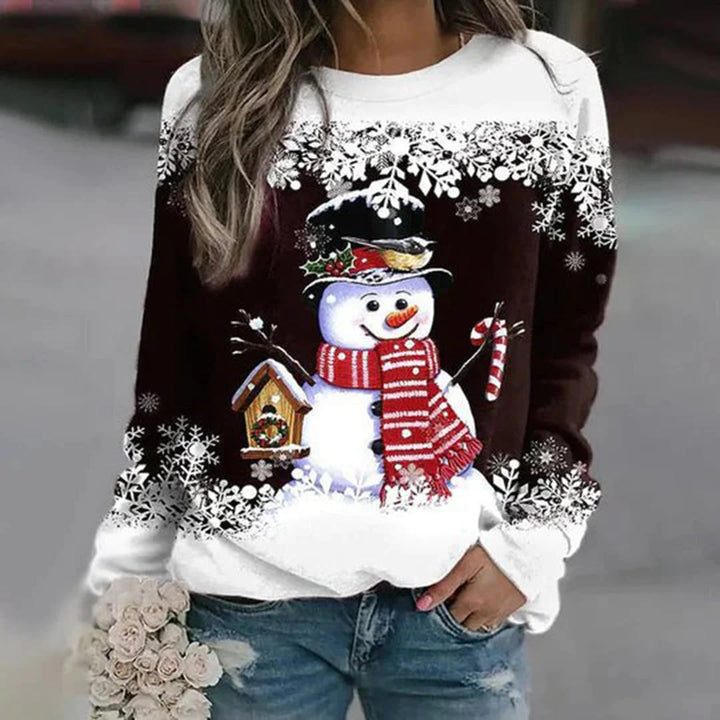 Dunkelbrauner Damen Weihnachtspullover mit Schneemann-Design und Schneeflocken aus weichem, gemütlichem Material.