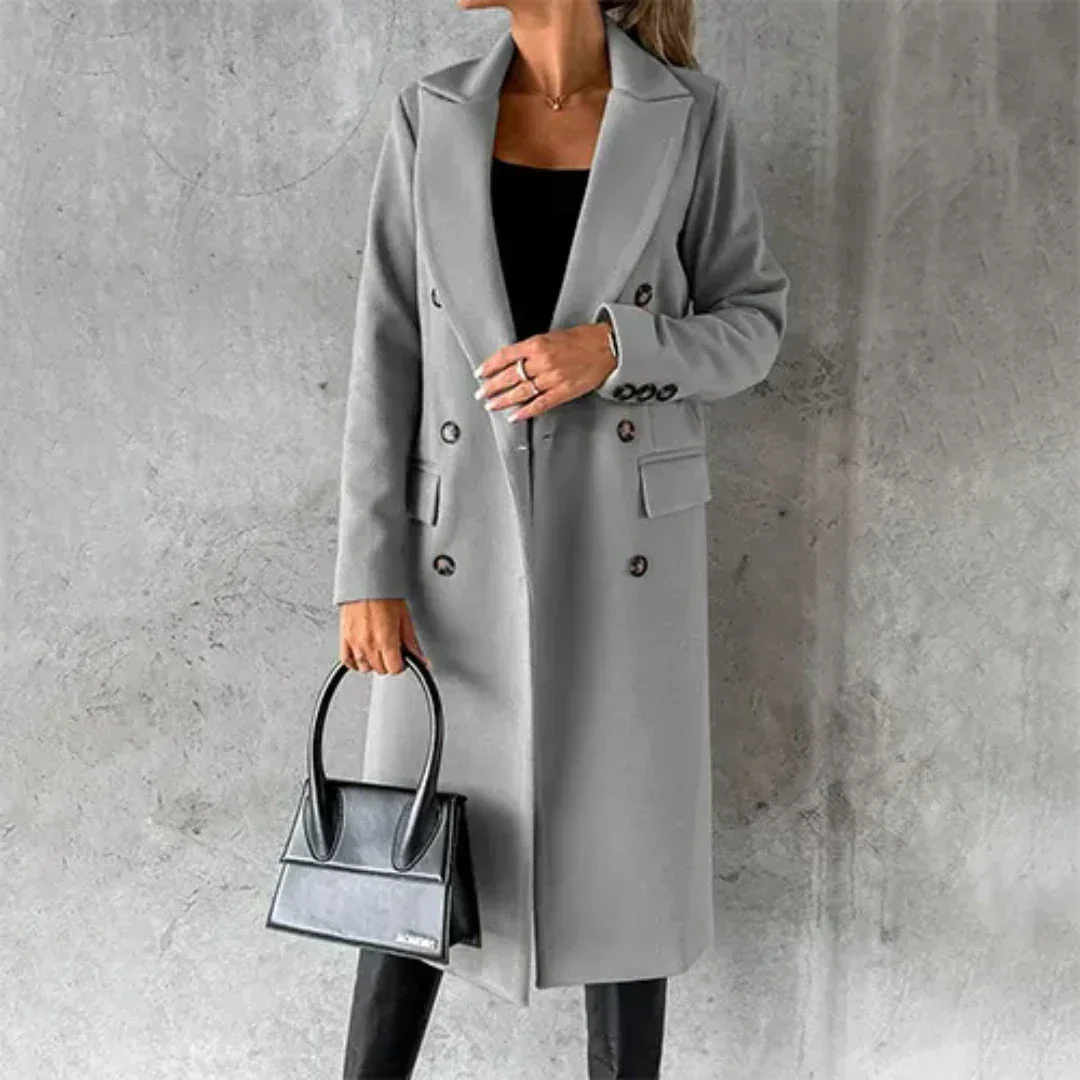 Grau Damen Winter Lang Trench Mantel aus warmem Stoff mit eleganter Knopfleiste und klassischem Schnitt für kalte Tage.