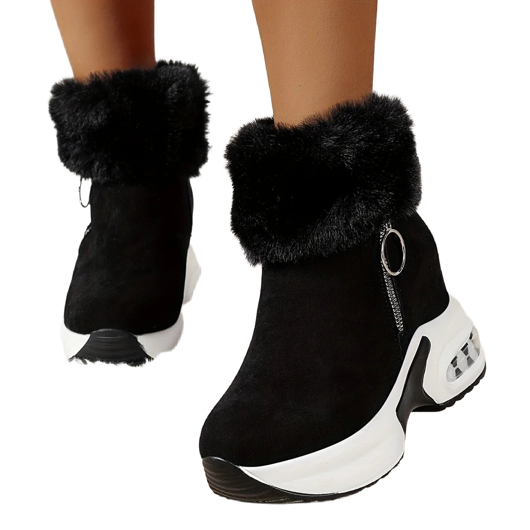 Schwarze Damen Stiefeletten aus Kunstleder mit seitlichem Reißverschluss und warmem Plüschfutter für zusätzlichen Komfort.