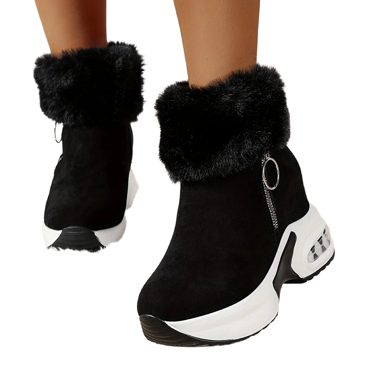 Schwarze Damen Stiefeletten aus Kunstleder mit seitlichem Reißverschluss und warmem Plüschfutter für zusätzlichen Komfort.