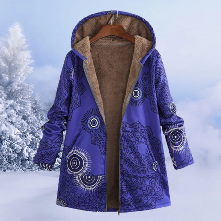 Damen Winterjacke in Blau mit Kapuze, floralem Muster und warmem, wasserabweisendem Material für kalte Tage.