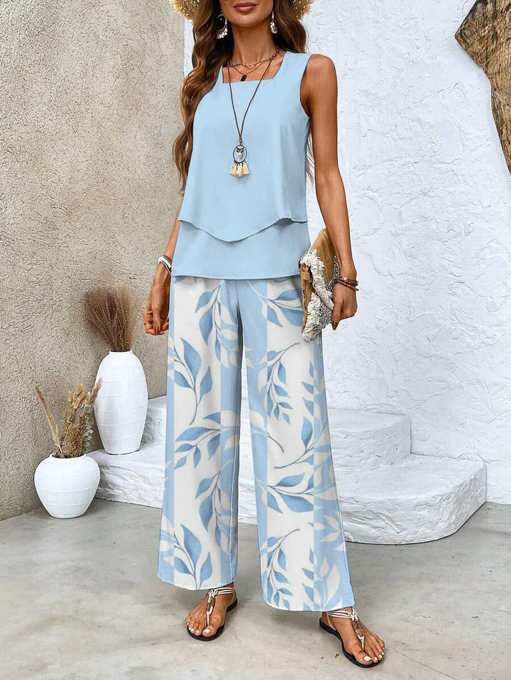 Damen Zweiteiliges Set in Blau mit ärmellosem Top und bedruckter Hose, aus leichtem Stoff, perfekt für den Sommerlook.