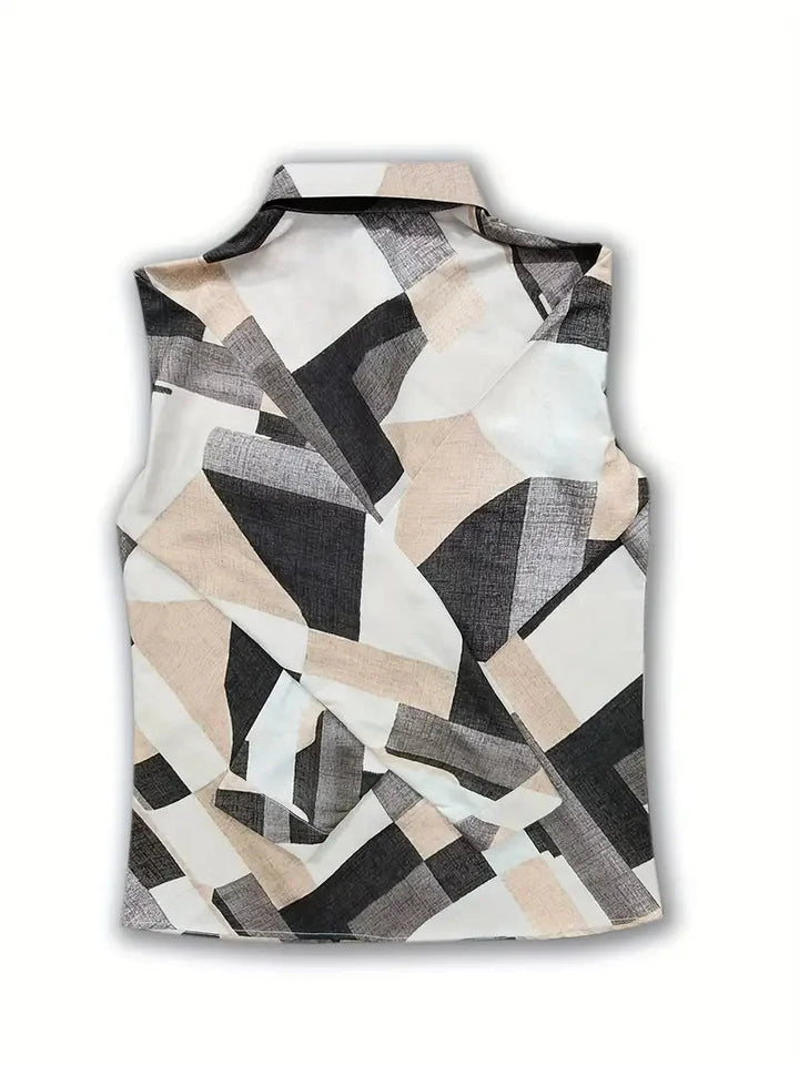 Damenbluse aus leichtem Stoff mit grünem Blattmuster und eleganten Dreiviertelärmeln, ideal für Alltag und Freizeit.