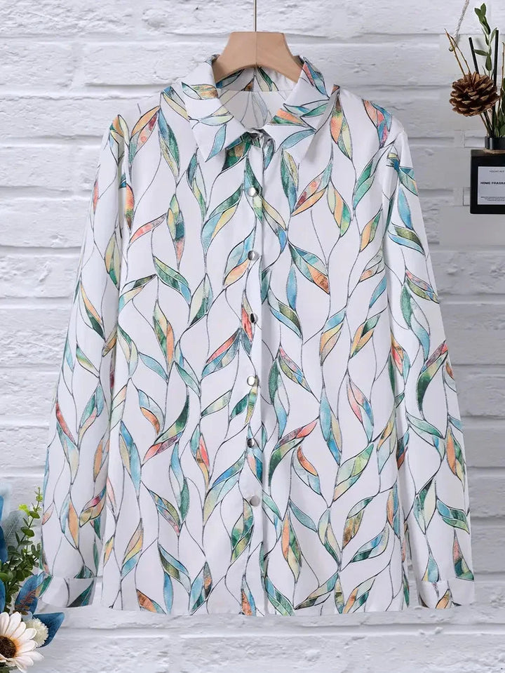 Damenbluse mit Blattmuster, aus leichtem Baumwollmix, mit eleganten Dreiviertelärmeln für einen lässigen Look.