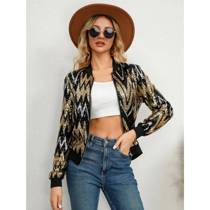 Schwarze Damenjacke mit goldenen Pailletten, Reißverschluss und modernem Schnitt für einen stilvollen Look.