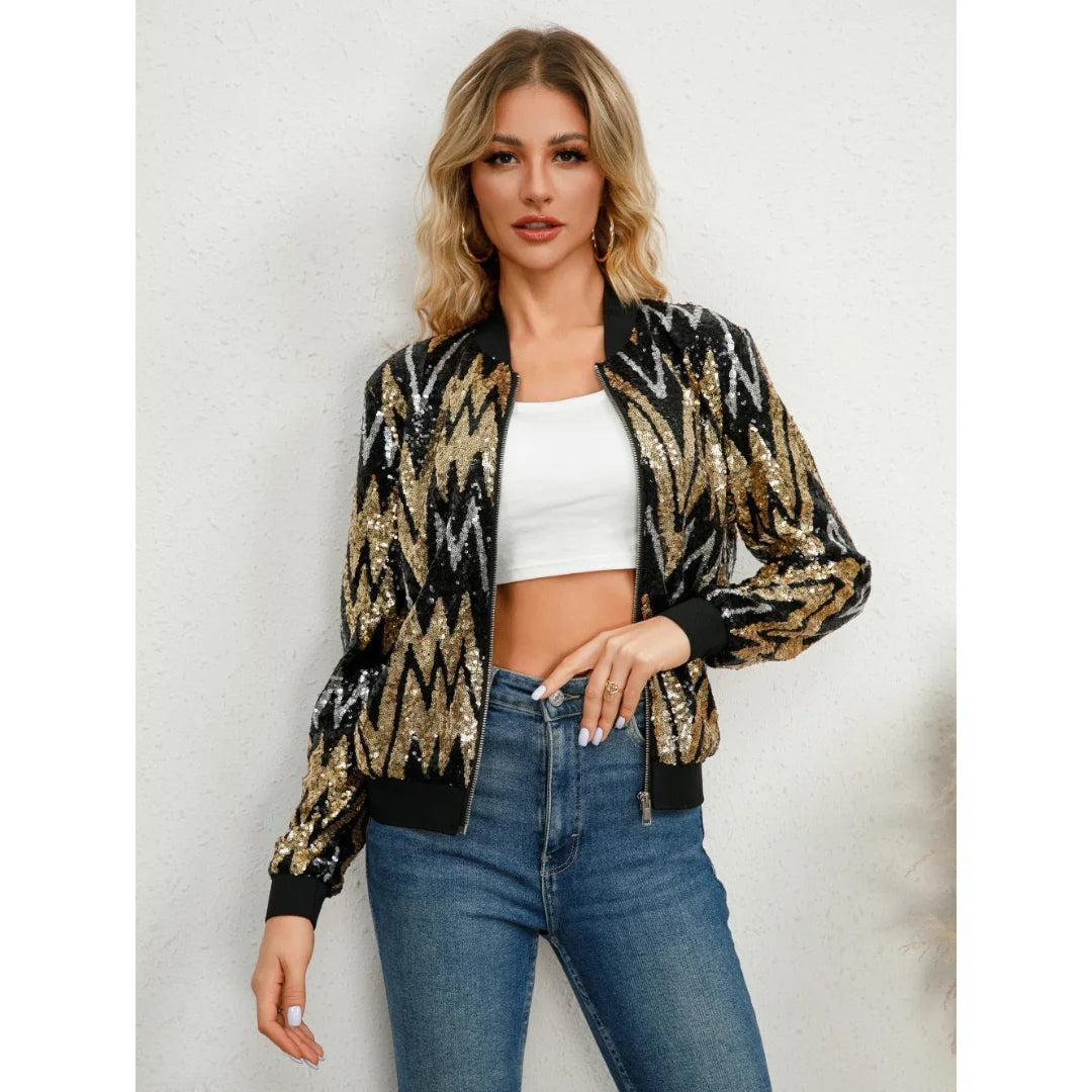 Schwarze Damenjacke mit goldenen Pailletten, Reißverschluss und modernem Design, ideal für festliche Anlässe.