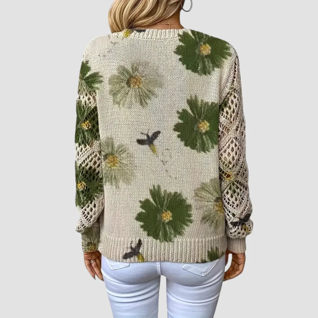 Damenpullover mit Blumenmuster aus weicher Baumwolle, gekennzeichnet durch zarte Häkel-Details an Ärmeln und Saum.
