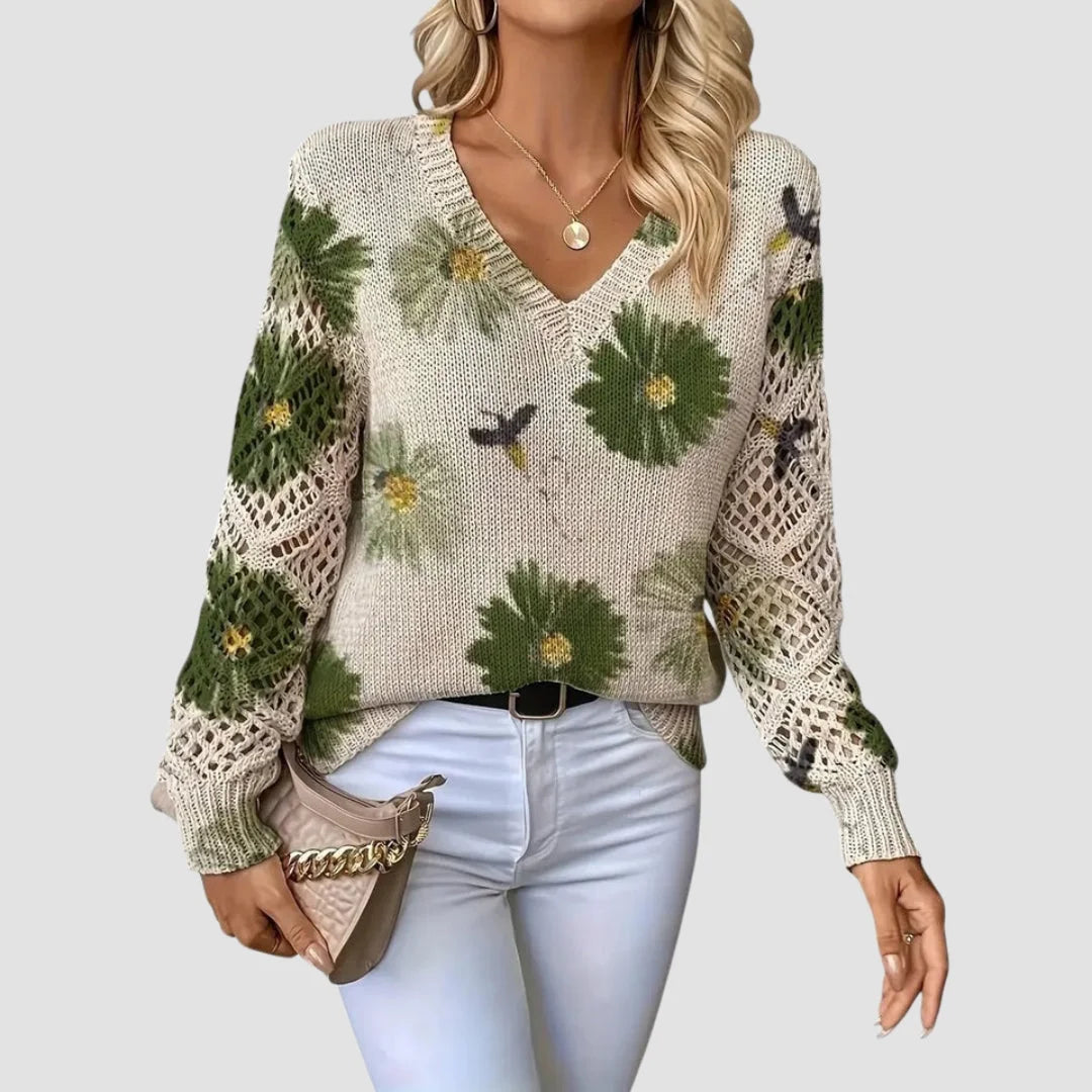 Damenpullover in Grün mit Blumenmuster, Häkel-Details und weichem Material für trageangenehmen Komfort.