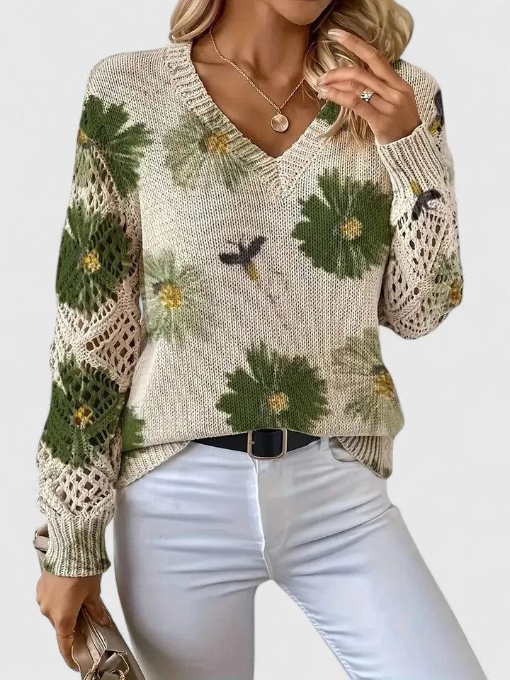 Grüner Damenpullover mit Floralmuster, V-Ausschnitt und weichem Material für komfortablen Tragekomfort und stilvolles Design.
