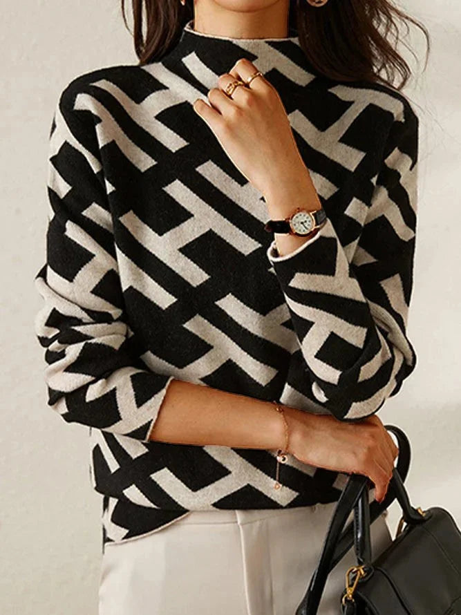 Damenpullover in Schwarz-Weiß mit geometrischem Muster, aus weicher Baumwolle gefertigt, ideal für Freizeit und Alltag.