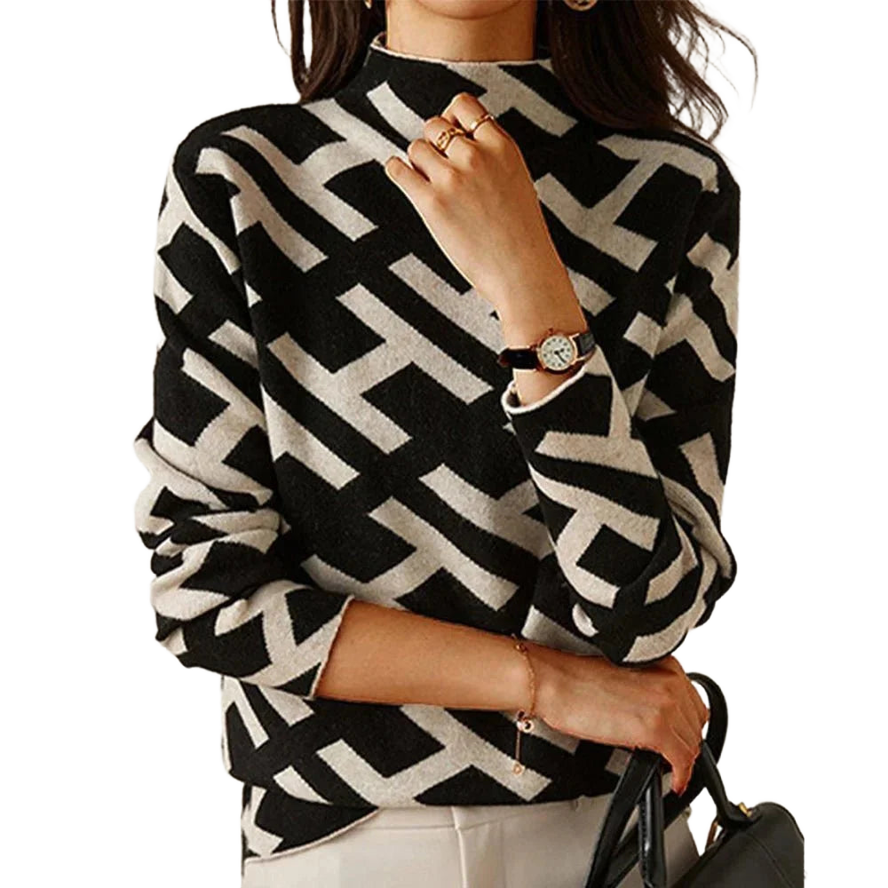 Schwarzer Damenpullover mit geometrischem Muster in Schwarz-Weiß aus weichem Material, ideal für den lässigen Alltag.