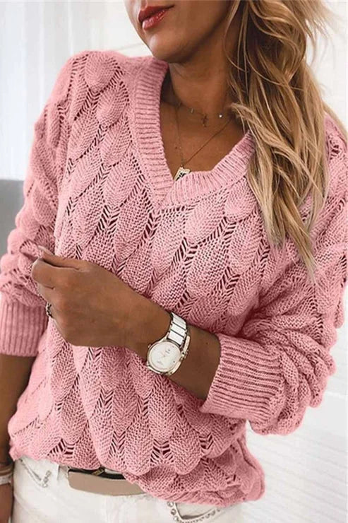 Rosa Damenpullover mit V-Ausschnitt, stylischem Strickmuster und weichem Material für komfortable Passform.