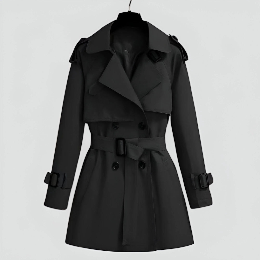 Klassischer schwarzer Damen Trenchcoat aus Baumwolle mit Gürtel, Knöpfen und seitlichen Taschen für einen zeitlosen Look.