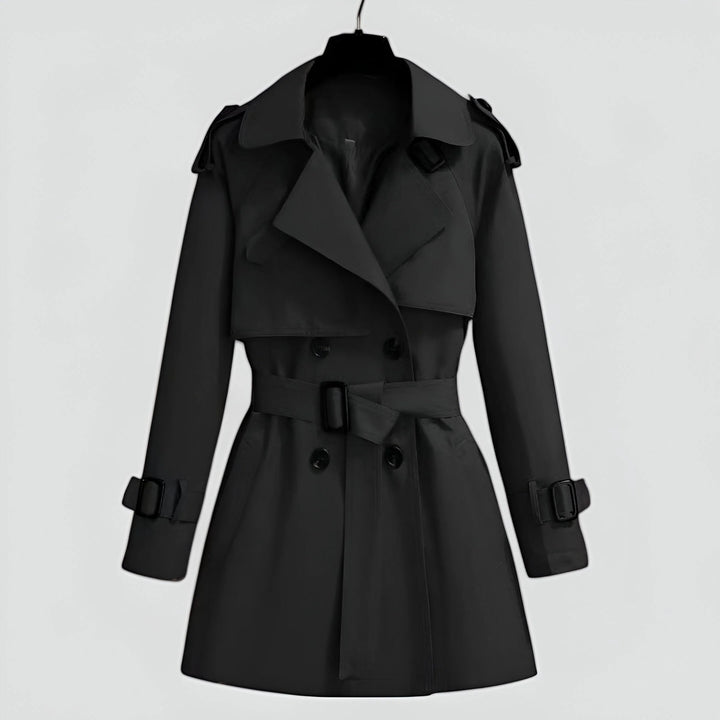 Klassischer schwarzer Damen Trenchcoat aus Baumwolle mit Gürtel, Knöpfen und seitlichen Taschen für einen zeitlosen Look.