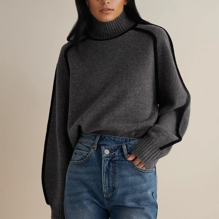 Dunkelgrauer Rollkragenpullover aus weichem Strick für einen lässigen Herbst-Look, mit modernem, minimalistischen Design.
