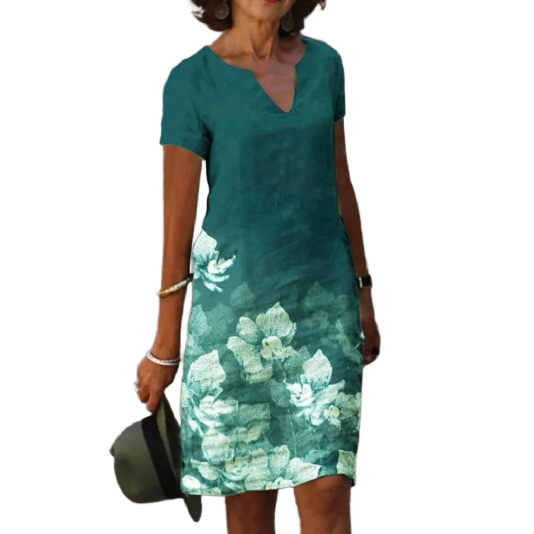 Grünes Damen Sommerkleid mit Blumendruck, V-Ausschnitt und luftigem Stoff - perfekt für sonnige Tage und entspannte Outfits.